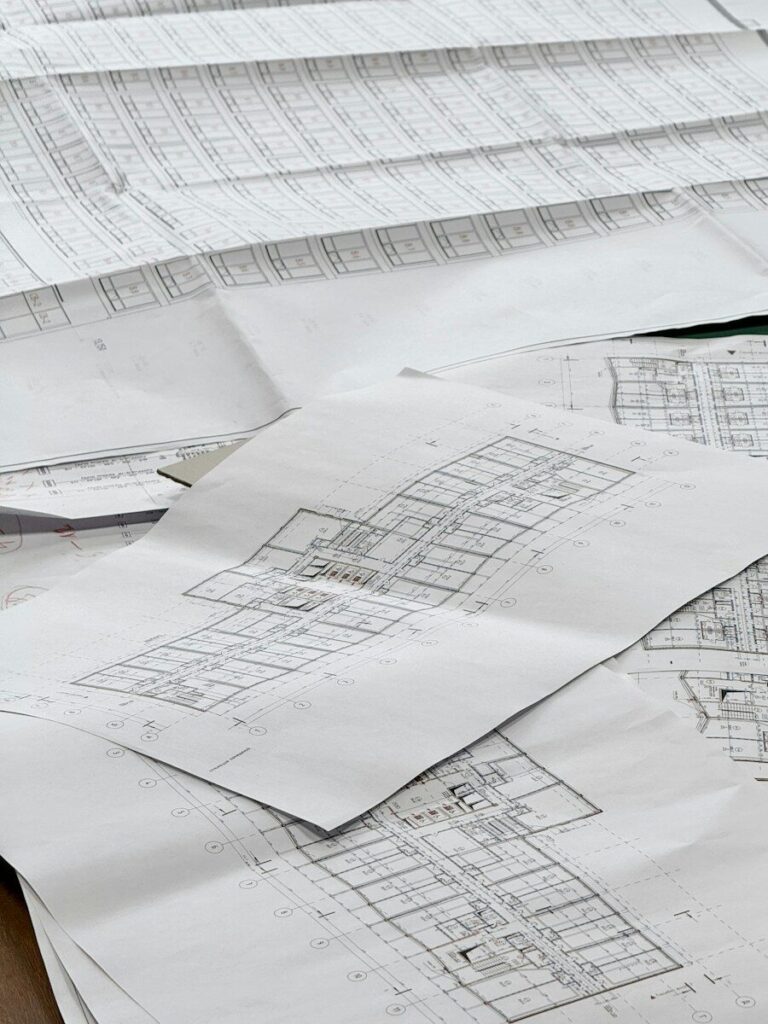 Architectural blueprints spread out on a surface